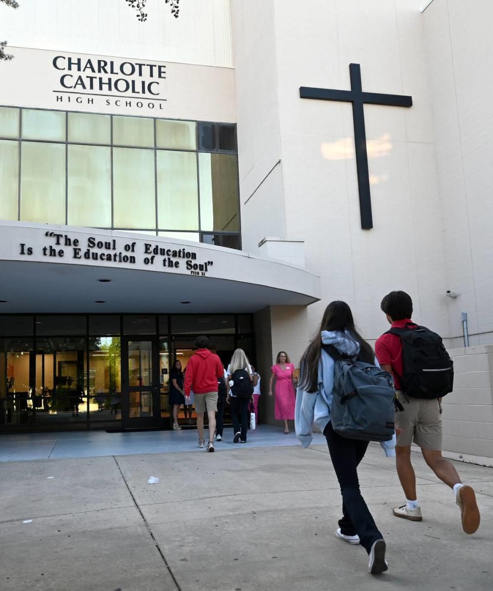 Charlotte Catholic High School students arrive for the first day of school on Wednesday, August 16, 2023.