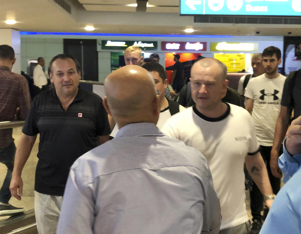 Mariners from the MT Front Altair arrive at Dubai International Airport in Dubai, United Arab Emirates, on Saturday, June 15, 2019, after spending two days in Iran. Associated Press journalists saw the crew members of the MT Front Altair on Saturday night after their Iran Air flight from Bandar Abbas, Iran, landed in Dubai in the United Arab Emirates. The Norwegian-owned oil tanker was attacked Thursday, June 13 in the Gulf of Oman. The U.S. has accused Iran of attacking the Front Altair and another oil tanker with limpet mines. Iran has denied the allegations. (AP Photo/Jon Gambrell)