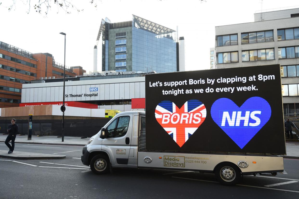 A billboard van outside St Thomas' Hospital in Central London where Prime Minister Boris Johnson is in intensive care as his coronavirus symptoms persist: PA
