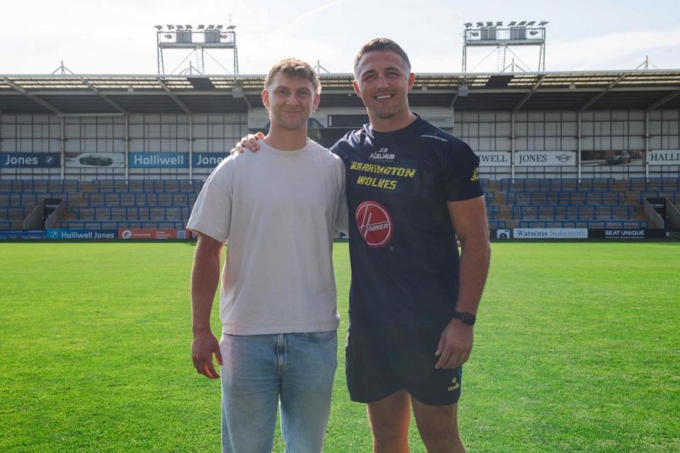 Alfie Johnson with Wire head coach Sam Burgess <i>(Image: Joe Richardson/Warrington Wolves)</i>