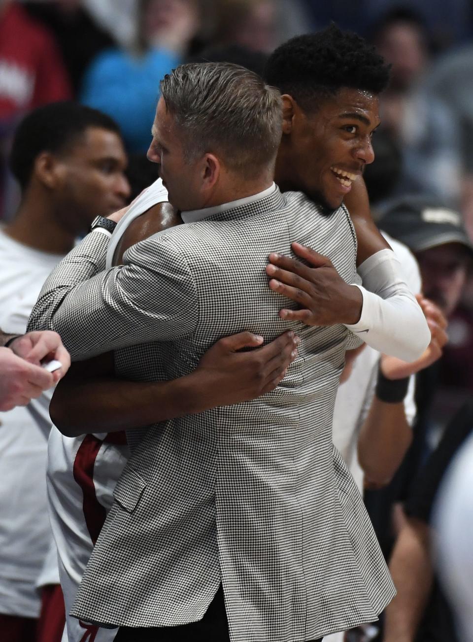 Crimson Tide forward Brandon Miller celebrates with coach Nate Oats late in the second half of a win against Texas A&M.