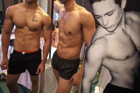 Models gather during a blood tests party as part of a campaign to prevent HIV infection among male same-sex couples, in Bangkok September 20, 2014. REUTERS/Athit Perawongmetha