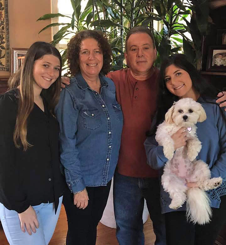 Saige, right, with her sister, Ivy, mother, Liz and father, Alan. (Courtesy of Saige Kratenstein)