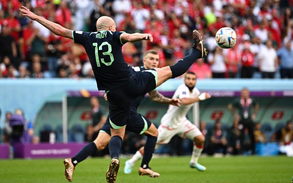 Aaron Mooy kicks the ball during the Qatar 2022 World Cup Group D football match between Tunisia and Australia at the Al-Janoub Stadium in Al-Wakrah, south of Doha on November 26, 2022 - ANNE-CHRISTINE POUJOULAT/AFP via Getty Images