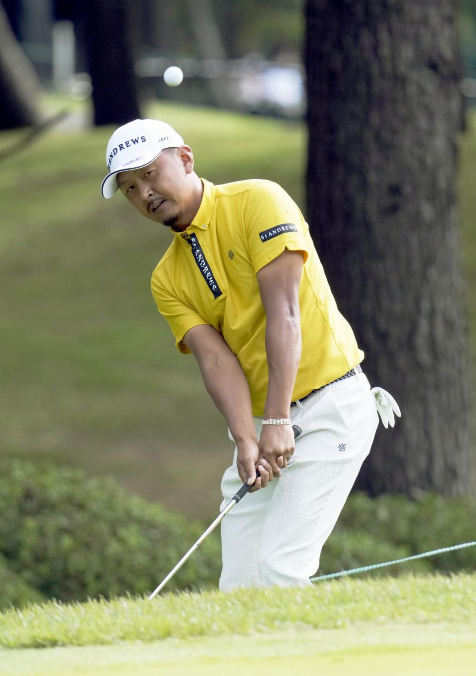 Japanese golfer Hiroshi Iwata plays an approach shot to take the first-round lead at the PGA Tour’s Zozo Championship on Narashino Country Club course in Chiba, east of Tokyo, Thursday, Oct, 21, 2021. (Kyodo News via AP)