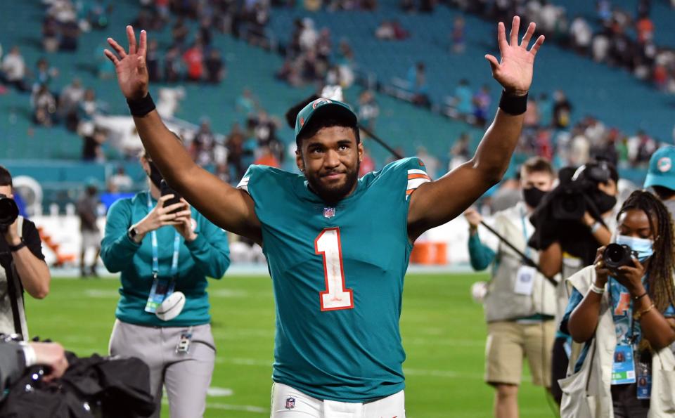 Miami Dolphins quarterback Tua Tagovailoa (1) walks off the field after a victory over the New England Patriots at Hard Rock Stadium in Miami Gardens, Jan. 9, 2022. 