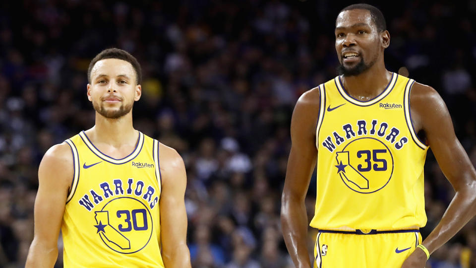 Steph Curry, pictured alongside former teammate Kevin Durant, says he prefers championships over iso-ball.