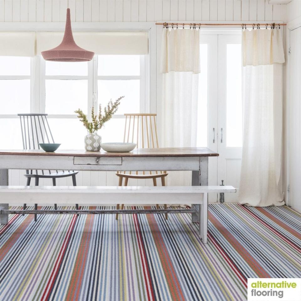 <p>The ultimate statement carpet. Margo Selby's signature colourful pattern is writ large in this rainbow striped carpet at Alternative Flooring, contrasting soft blues and greens with warm oranges and reds. </p><p>Pictured: <a href="https://www.alternativeflooring.com/collection/wool/margo-selby-stripe/margo-selby-stripe-frolic/westbrook.html" rel="nofollow noopener" target="_blank" data-ylk="slk:Margo Selby Stripe Frolic Westbrook Carpet at Alternative Flooring;elm:context_link;itc:0;sec:content-canvas" class="link ">Margo Selby Stripe Frolic Westbrook Carpet at Alternative Flooring</a></p>