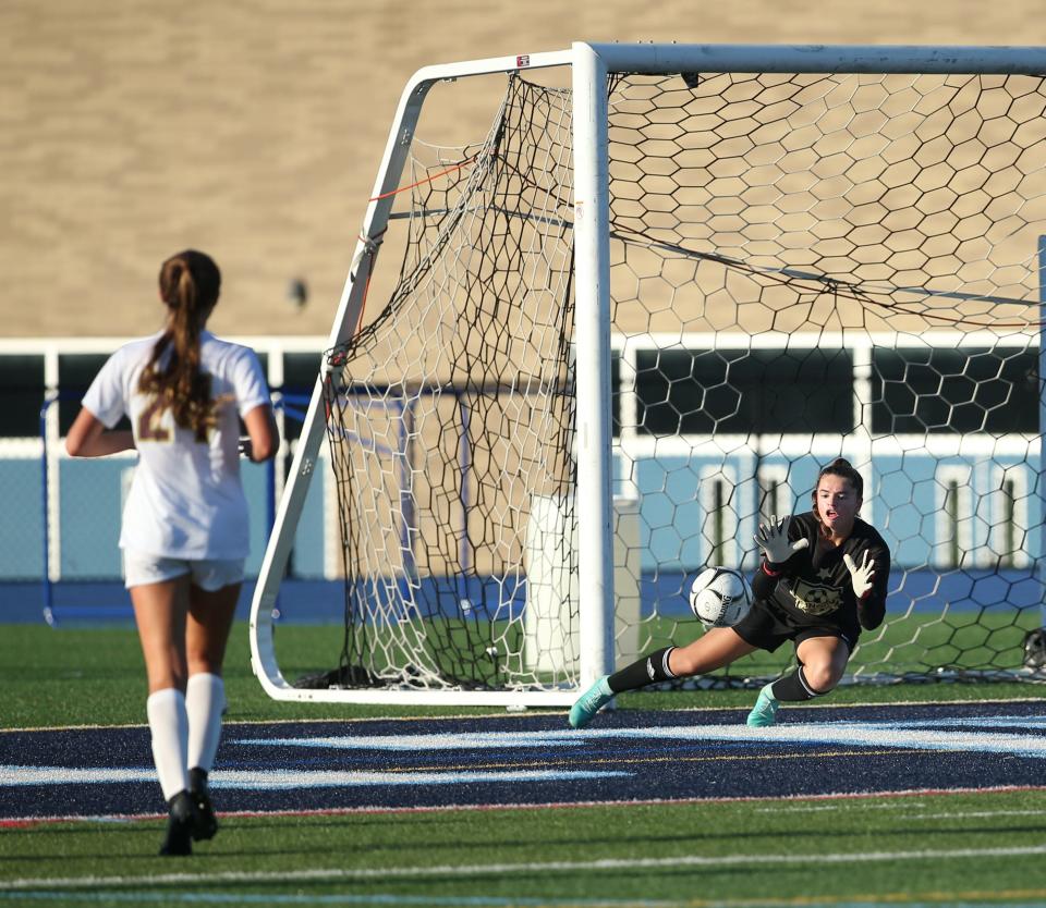 Arlington's Kayla Kalbaugh blocks a shot from a John Jay forward during Wednesday's game on October 4, 2023.