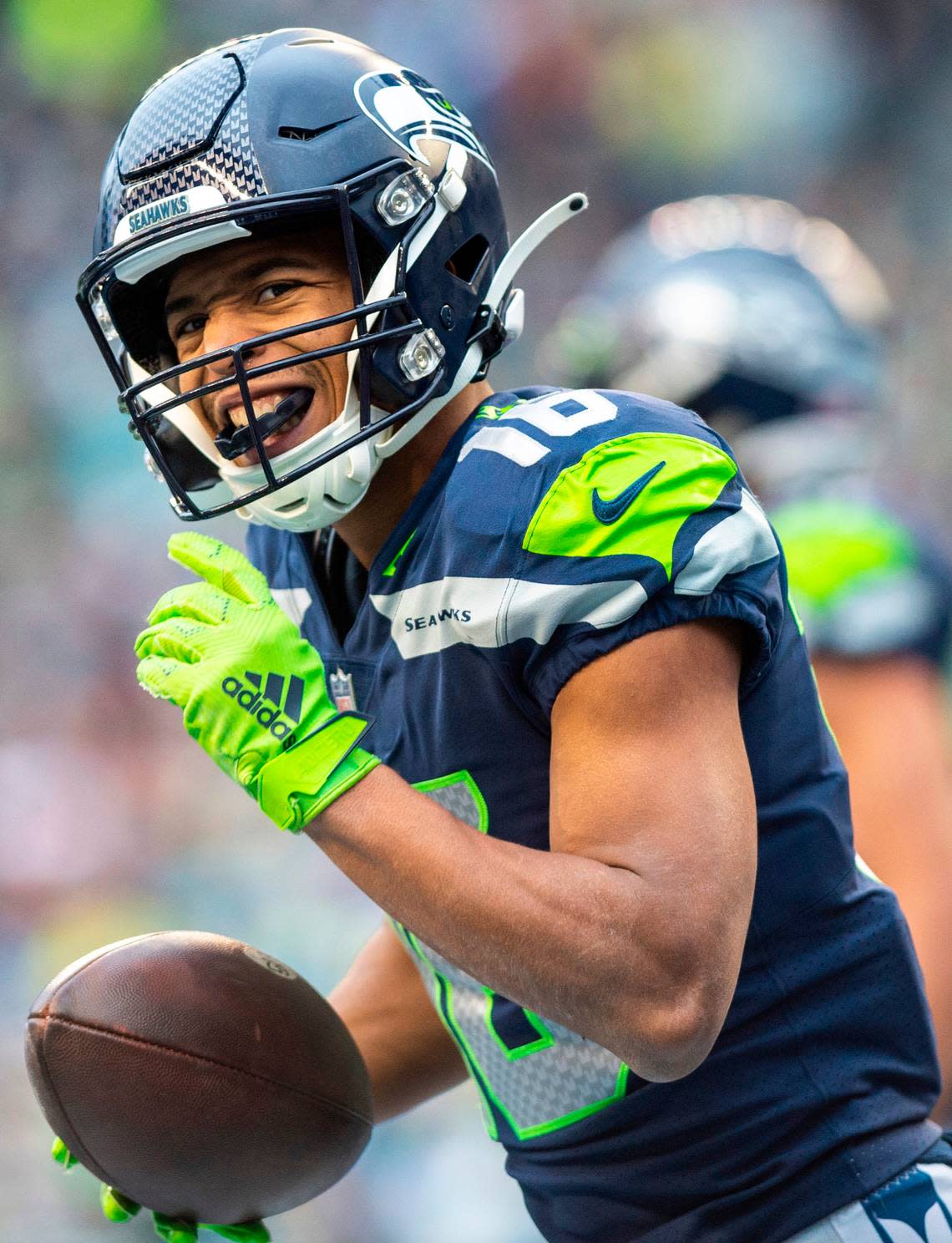 Seattle Seahawks wide receiver Tyler Lockett (16) celebrates scoring a touchdown in the second quarter of an NFL game against the Carolina Panthers at Lumen Field in Seattle Wash., on Dec. 11, 2022. The Seahawks lost to the Panthers 24-30.