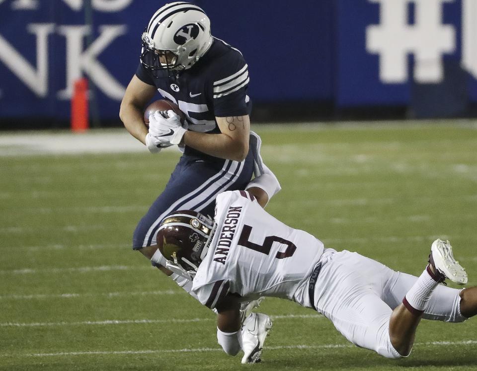 Former BYU tight end Hank Tuipulotu runs by <a class="link " href="https://sports.yahoo.com/ncaaf/teams/texas/" data-i13n="sec:content-canvas;subsec:anchor_text;elm:context_link" data-ylk="slk:Texas;sec:content-canvas;subsec:anchor_text;elm:context_link;itc:0">Texas</a> State safety Kevin Anderson in Provo on Saturday, Oct. 24, 2020. He has moved on from football after suffering two season-ending injuries. | Jeffrey D. Allred, Deseret News