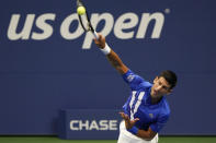 Novak Djokovic, of Serbia, serves to Damir Dzumhur, of Bosnia and Herzegovina, during the first round of the US Open tennis championships, Monday, Aug. 31, 2020, in New York. (AP Photo/Frank Franklin II)