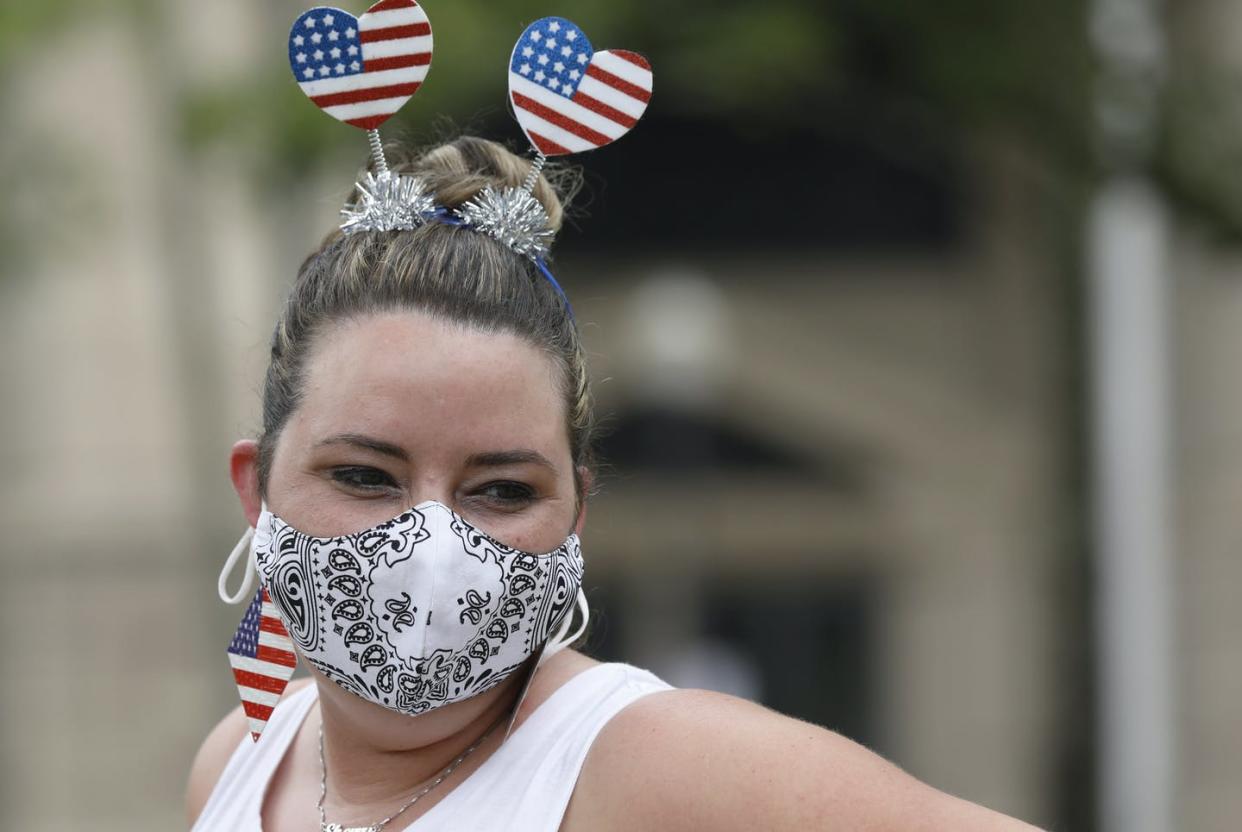 <span class="caption">Sherry Brewer, a teacher at the Galloway Children's Center, watches over children as they enjoy snacks after a pre-Fourth of July parade in Jackson, Mississippi, June 26, 2020.</span> <span class="attribution"><a class="link " href="http://www.apimages.com/metadata/Index/Mississippi-Daily-Life/62a78de440d4429381fa1739fbf59ae7/69/0" rel="nofollow noopener" target="_blank" data-ylk="slk:AP Photo/Rogilio V. Solis;elm:context_link;itc:0;sec:content-canvas">AP Photo/Rogilio V. Solis</a></span>