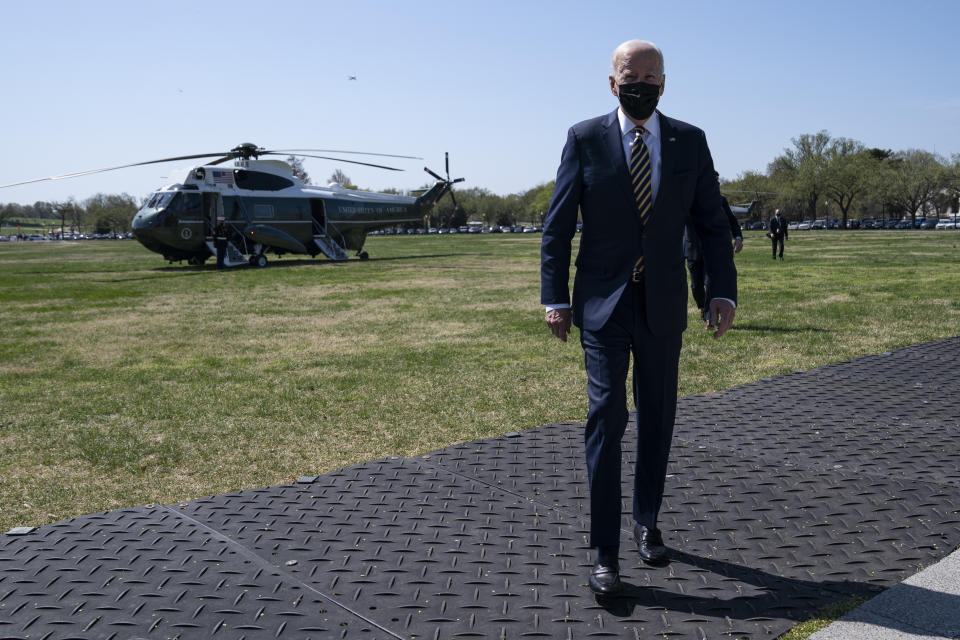 President Joe Biden walks over to speak with reporters on the Ellipse on the National Mall after spending the weekend at Camp David, Monday, April 5, 2021, in Washington. (AP Photo/Evan Vucci)