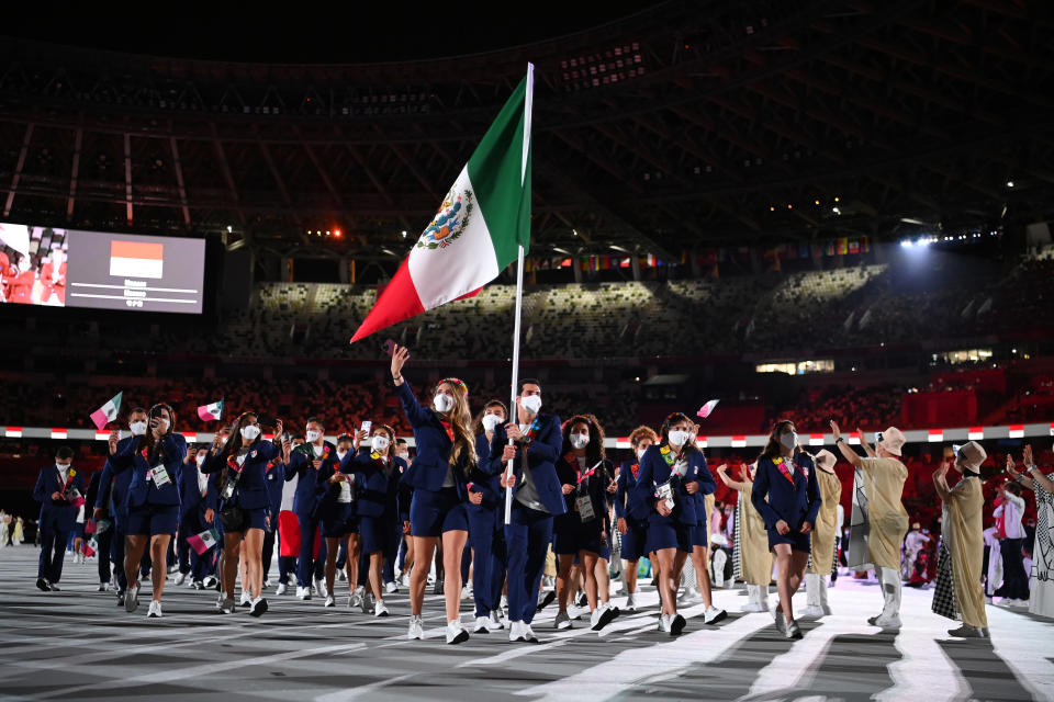 TOKYO, JAPAN - JULY 23: Flag bearers Gabriela Lopez and Rommel Pacheco Marrufo of Team Mexico during the Opening Ceremony of the Tokyo 2020 Olympic Games at Olympic Stadium on July 23, 2021 in Tokyo, Japan. (Photo by Matthias Hangst/Getty Images)