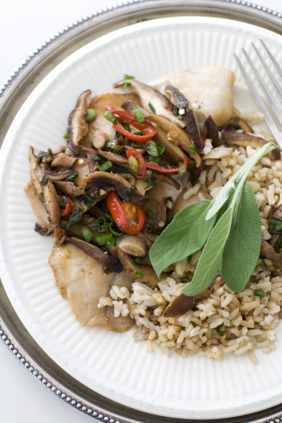 In this image taken on Dec. 3, 2012, Chinese-styled steamed tilapia is shown served on a plate in Concord, N.H. (AP Photo/Matthew Mead)