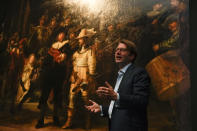 The added part of the painting is seen right as Rijksmuseum director Taco Dibbits explains how Rembrandt's biggest painting the Night Watch just got bigger with the help of artificial intelligence in Amsterdam, Netherlands, Wednesday, June 23, 2021. The Dutch national museum and art gallery reveals findings from a long-term project to examine in minute detail Rembrandt van Rijn's masterpiece the Night Watch. (AP Photo/Peter Dejong)