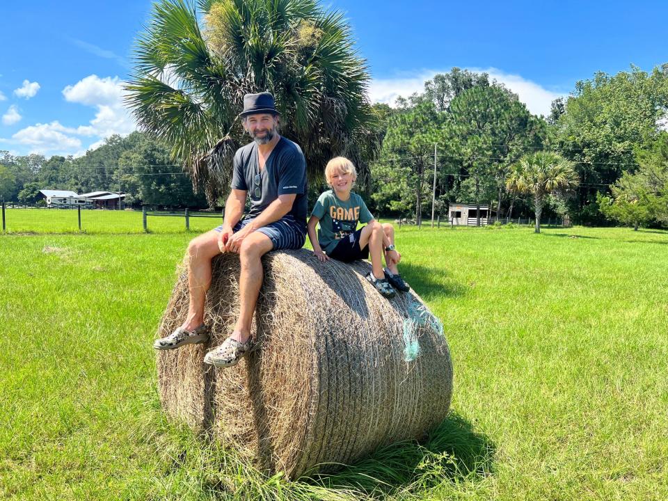Buccan chef Clay Conley and son Camden relax at the family farm near Gainesville, FL.