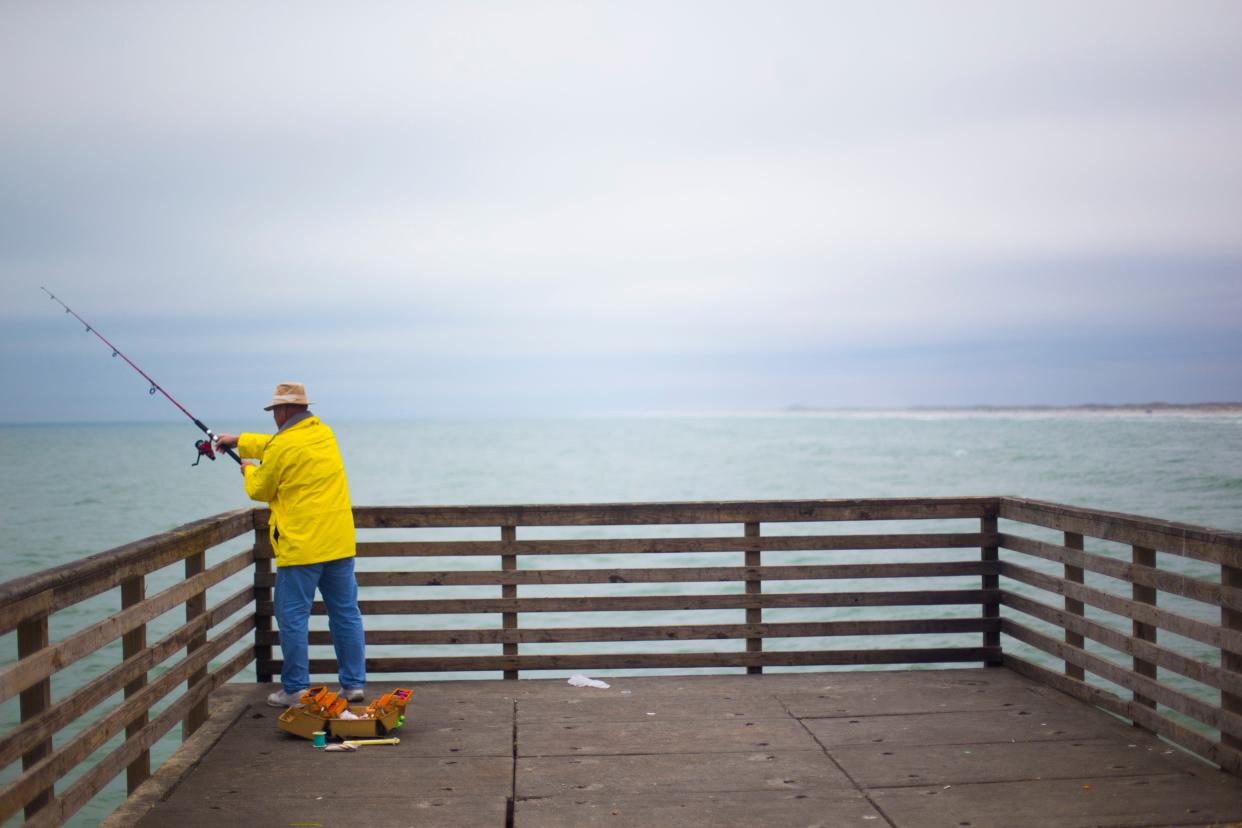 Doug Sanford casts his line into the Gulf of Mexico at Bob Hall Pier in Corpus Christi Monday afternoon, March 16, 2015. Sanford like to catch and release, and says that fishing is a sort of relaxation and therapy for him. 