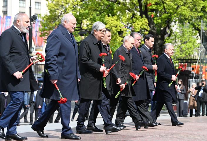 From left, Armenian Prime Minister Nikol Pashinyan, Belarusian President Alexander Lukashenko, Kazakhstan's President Kassym-Jomart Tokayev, Kyrgyzstan's President Sadyr Japarov, Russian President Vladimir Putin, Tajikistan's President Emomali Rahmon, Turkmenistan's President Serdar Berdimuhamedov and Uzbekistan's President Shavkat Mirziyoyev take part in a wreath-laying ceremony on Victory Day marking the 78th anniversary of the Victory over Nazi Germany in World War Two, at the Tomb of the Unknown Soldier at the Kremlin wall in Moscow, Russia, Tuesday, May 9, 2023. (Alexey Maishev, Sputnik, Kremlin Pool Photo via AP)