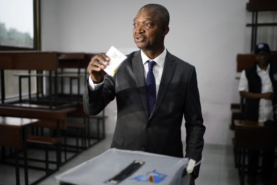 Ruling party presidential candidate Emmanuel Ramazani Shadary casts his vote Sunday, Dec. 30, 2018 in Kinshasa, Congo. Forty million voters are registered for a presidential race plagued by years of delay and persistent rumors of lack of preparation. (AP Photo/Jerome Delay)