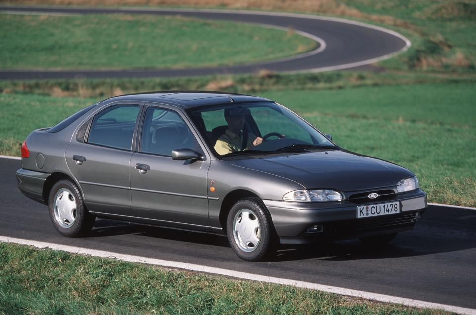 <p>Introduced in <strong>1992</strong>, and celebrated as a world car, the first-generation Mondeo played a significant role in propelling Ford of Europe to stardom during the 1990s. In the UK, it helped Ford outsell Vauxhall, its arch rival. It later became the <strong>Contour</strong> in America, and it spawned the <strong>Mercury Mystique</strong>. <strong>118,040 units</strong> of the Mondeo were sold in the UK in <strong>1995</strong>, a figure that placed it in third place behind the Escort and the Fiesta, and comfortably ahead of the Vauxhall Cavalier (<strong>73,978 sales</strong>). It was a company car, a family car, and a sports car when Ford added V6-powered ST-branded models to the line-up in the late 1990s.</p><p>Demand for the Mondeo gradually dropped during the 2000s; sales totalled <strong>57,589 units</strong> in 2005. It lost its world car vocation when Ford chose not to replace the Contour, but the Mondeo returned to the United States as the Fusion in 2012. Designing one saloon for two markets made sense, because sales were too low in each to justify making a country-specific car. By 2017, the Mondeo had fallen off the UK’s top-10 list, and the Fusion lingered in 19<sup>th</sup> spot with 209,623 sales, far behind its main rivals.</p>