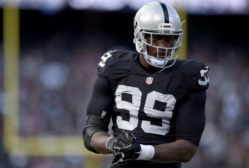 OAKLAND, CA - NOVEMBER 15:  Aldon Smith #99 of the Oakland Raiders looks on during a timeout against the Minnesota Vikings in the third quarter of their NFL football game at O.co Coliseum on November 15, 2015 in Oakland, California.  (Photo by Thearon W. Henderson/Getty Images)