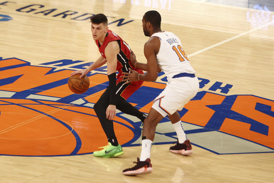 Alec Burks, right, of the New York Knicks defends against Tyler Herro, left, of the Miami Heat during an NBA basketball game on Sunday, Feb. 7, 2021, in New York City. (Mike Stobe/Pool Photo via AP)