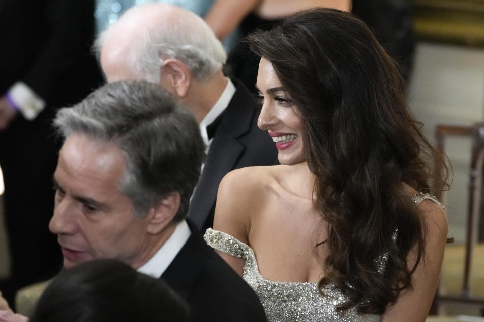 Lawyer Amal Clooney and Secretary of State Antony Blinken attend the Kennedy Center honorees reception at the White House in Washington, Sunday, Dec. 4, 2022. (AP Photo/Manuel Balce Ceneta)