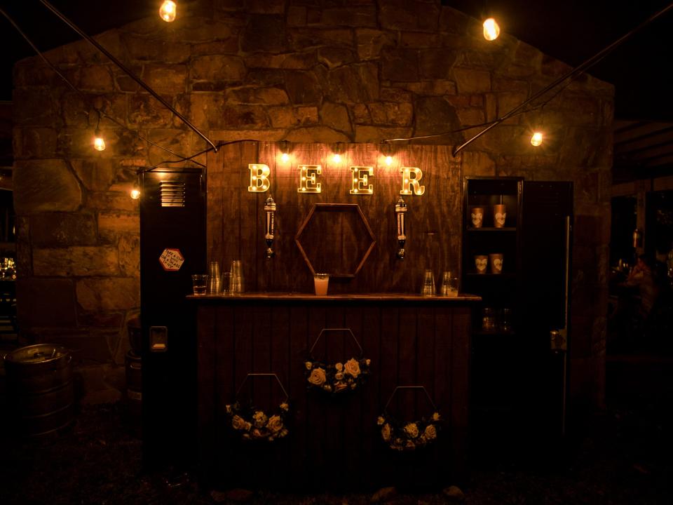 light up beer wall at campground wedding reception