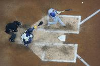 Los Angeles Dodgers' Will Smith hits an RBI sacricice fly during the fifth inning of a baseball game against the Milwaukee Brewers Monday, Aug. 15, 2022, in Milwaukee. (AP Photo/Morry Gash)