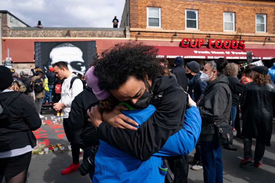 Nic Hernandez and Emma Ruddock hug in George Floyd Square after hearing that Derek Chauvin had been found guilty of murder.