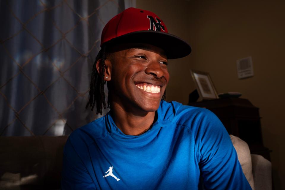 North Central High School junior Micah Rienstra-Kiracofe smiles while talking with his family Wednesday, May 3, 2023, at their home in Indianapolis.