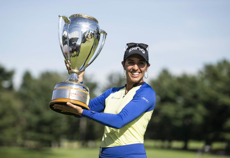 Paula Reto, of South Africa, holds the trophy after winning the the Canadian Pacific Women's Open golf tournament in Ottawa, on Sunday, Aug. 28, 2022. (Justin Tang/The Canadian Press via AP)