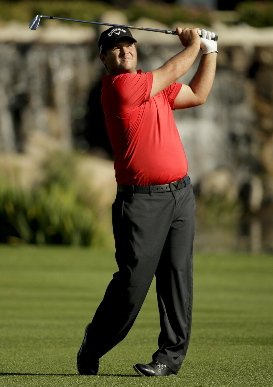 Patrick Reed watches his shot to the 18th green during the second round of the Humana Challenge golf tournament at La Quinta Country Club on Friday, Jan. 17, 2014, in La Quinta, Calif. (AP Photo/Chris Carlson)