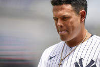 New York Yankees' Gio Urshela winces as he walks back to the dugout after a shard from his broken bat struck his eye when he grounded into a double play in the second inning of a baseball game against the Oakland Athletics, Saturday, June 19, 2021, in New York. (AP Photo/John Minchillo)