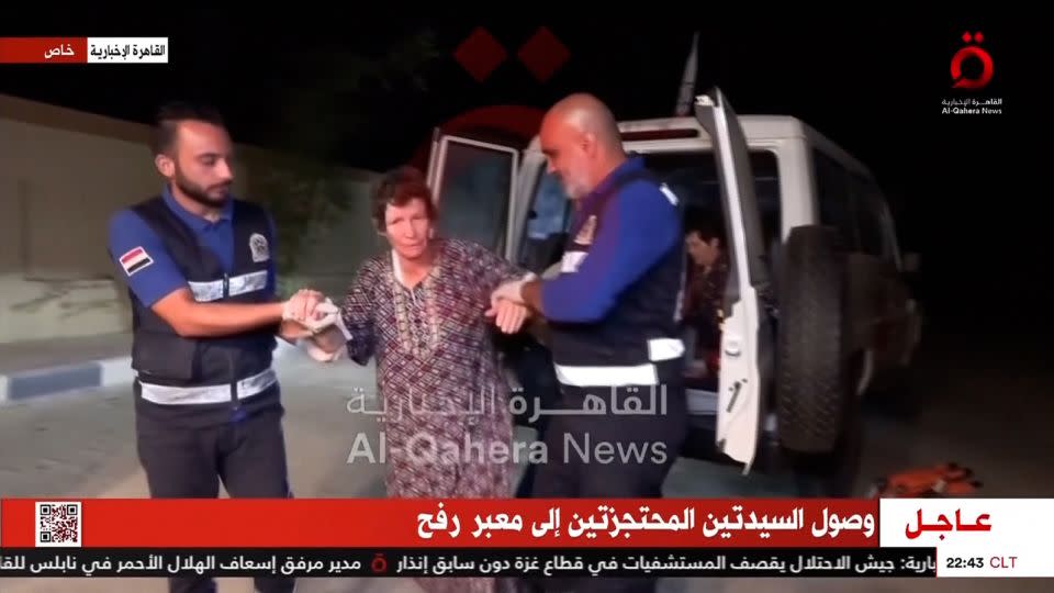 Yocheved Lifshitz as seen in a video following her release, accompanied out of an ambulance. - Al-Qahera News/Reuters