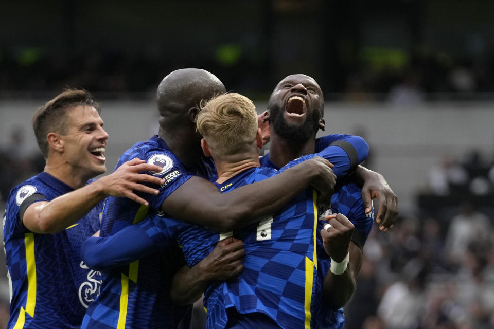 Chelsea's Antonio Rudiger, right, celebrates after scoring his side's third goal during the English Premier League soccer match between Tottenham Hotspur and Chelsea at the Tottenham Hotspur Stadium in London, England, Sunday, Sep. 19, 2021. (AP Photo/Matt Dunham)