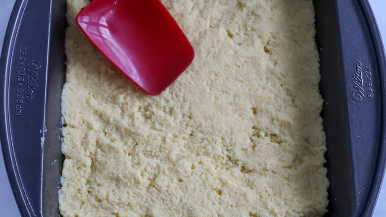 coffee cake batter spread in a pan