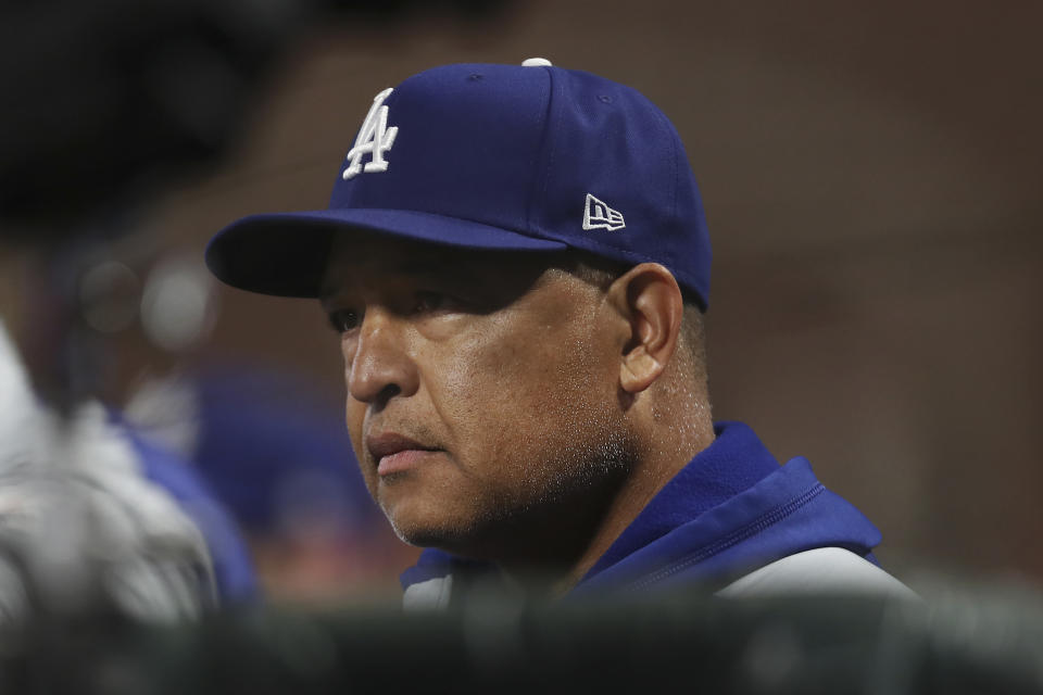 Los Angeles Dodgers manager Dave Roberts watches from the dugout during the sixth inning of Game 1 of his team's baseball National League Division Series against the San Francisco Giants Friday, Oct. 8, 2021, in San Francisco. (AP Photo/Jed Jacobsohn)