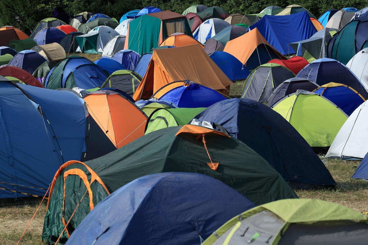 crowded camping site with tents