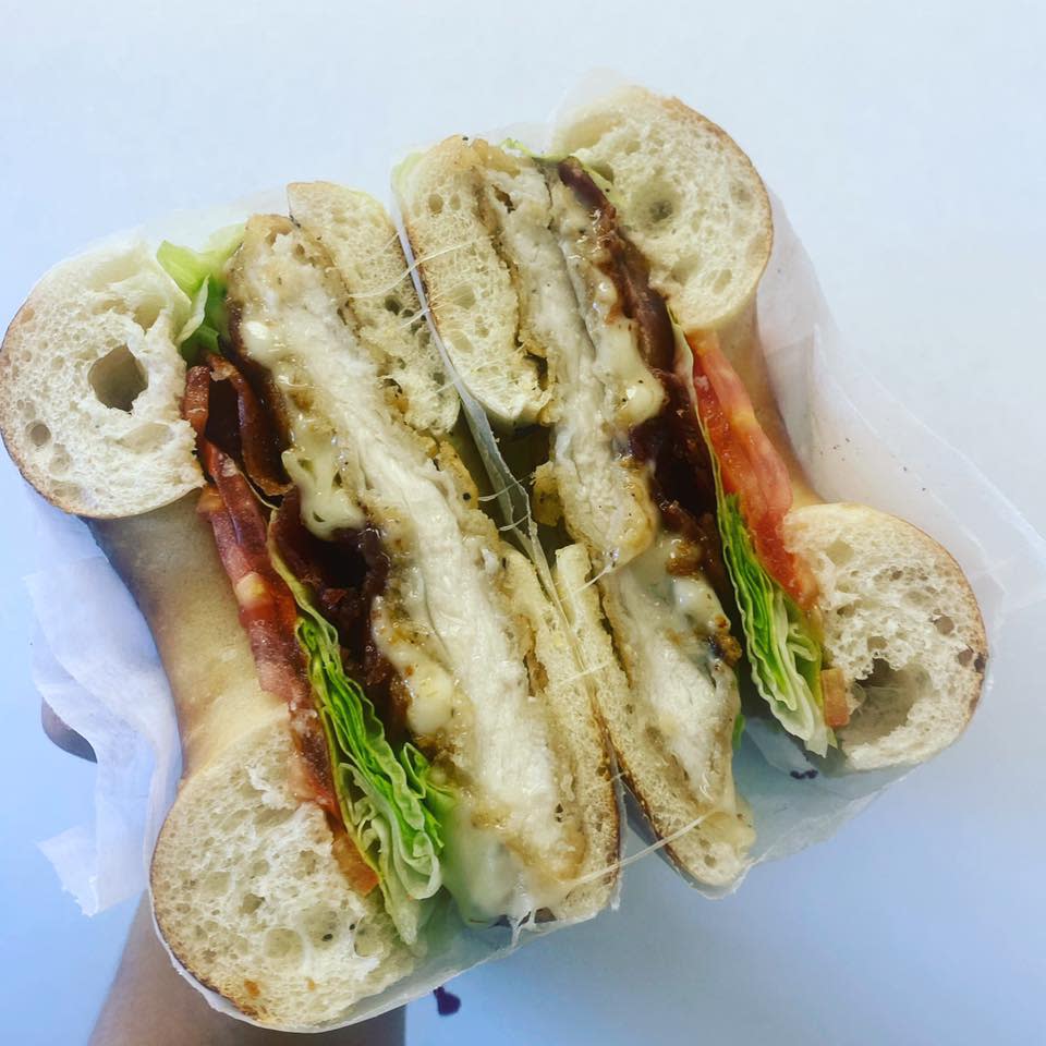 The Chicken Cutlet Classic with melted mozzarella, bacon, lettuce and tomato is a specialty sandwich available at Bagel Dock Express.