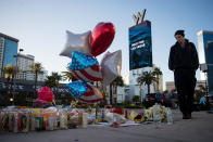 <p>Matthew Helms, who worked as a medic the night of the shooting, visits a makeshift memorial for the victims of Sunday night’s mass shooting, on the north end of the Las Vegas Strip, October 3, 2017 in Las Vegas, Nevada. (Photo: Drew Angerer/Getty Images) </p>