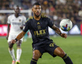 FILE - Los Angeles FC forward Denis Bouanga controls the ball against the LA Galaxy during the first half of an MLS playoff soccer match Oct. 20, 2022, in Los Angeles. Bouanga collected the 2023 MLS Golden Boot with 20 goals. (AP Photo/Ringo H.W. Chiu, File)