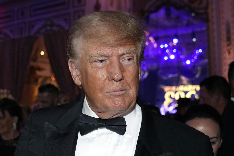 FILE — Former President Donald Trump arrives for a New Years Eve party at Mar-a-Lago, in Palm Beach, Fla., Dec. 31, 2022. Trump has abandoned efforts to revive his federal lawsuit against New York Attorney General Letitia James — the second time he's halted legal action against her after a judge last week fined him and his lawyers nearly $1 million for filing frivolous cases. (AP Photo/Lynne Sladky, File)