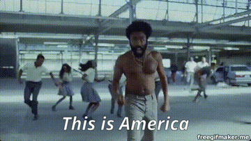 Person dancing among a crowd with the text "This is America" displayed