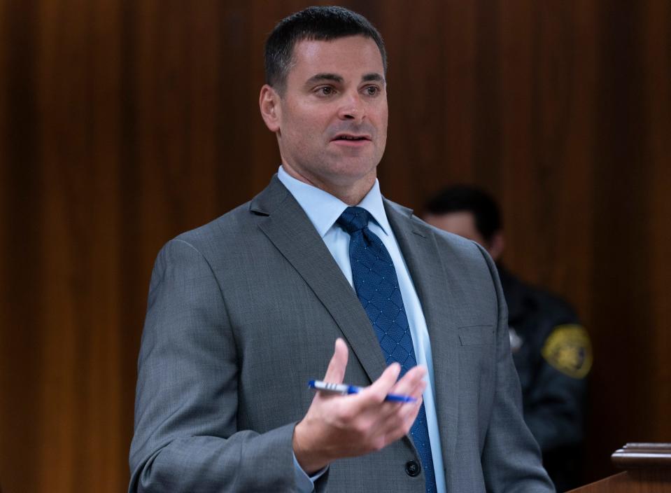 Assistant Oakland County Prosecutor Marc Keast, questions witness forensic psychiatrist Dr. Lisa Anacker as Ethan Crumbley appears in the Oakland County Courtroom of Kwame Rowe, on Friday, Aug. 18, 2023, in Pontiac, Mich. The Oakland County Prosecutors are making their case that Crumbley, a teenager, should be sentenced to life without parole for killing four students at Oxford High School in 2021.