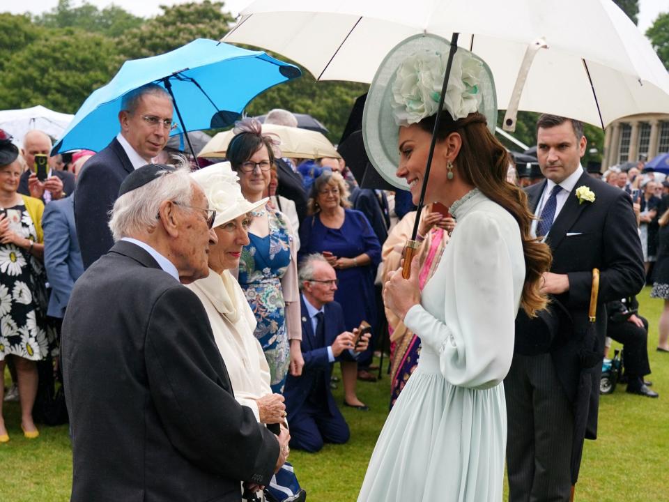 The Duchess of Cambridge meeting guests during a Royal Garden Party at Buckingham Palace in London (PA)