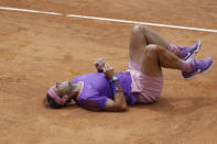 Spain's Rafael Nadal falls on the court as he attempts to return the ball to Germany's Alexander Zverev during their quarter-final match at the Italian Open tennis tournament, in Rome, Friday, May 14, 2021. (AP Photo/Gregorio Borgia)