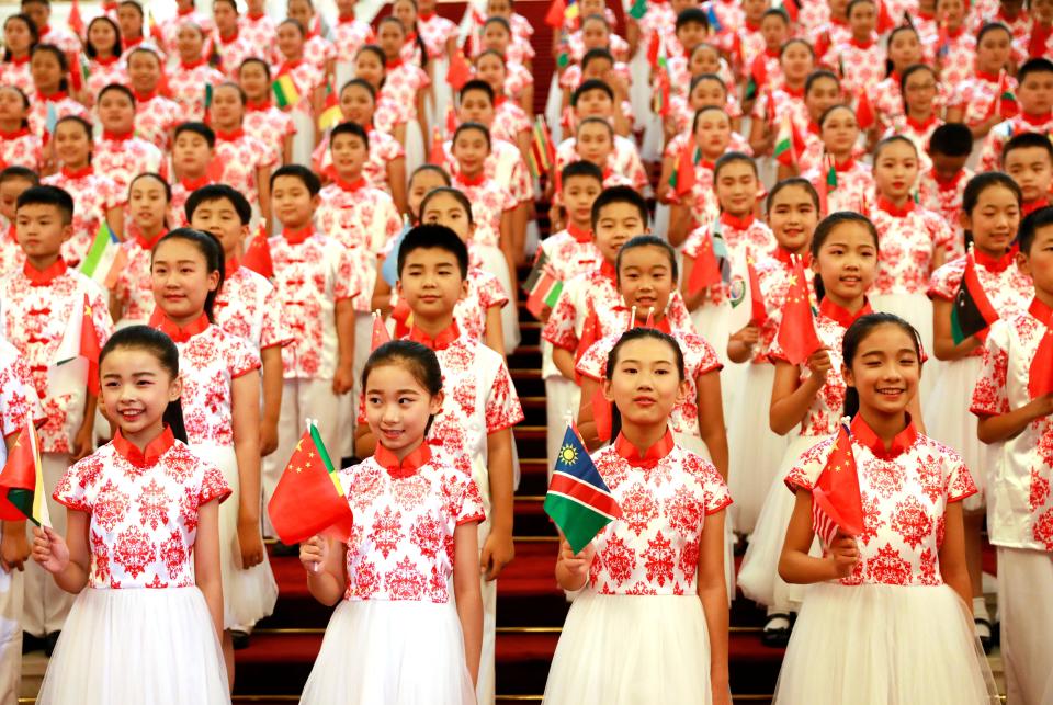 Chinese children hold flags during a rehearsal prior to the opening of the Forum on China-Africa Cooperation (FOCAC) 2018 Beijing Summit on Sept. 3, 2018 in Beijing, China. 